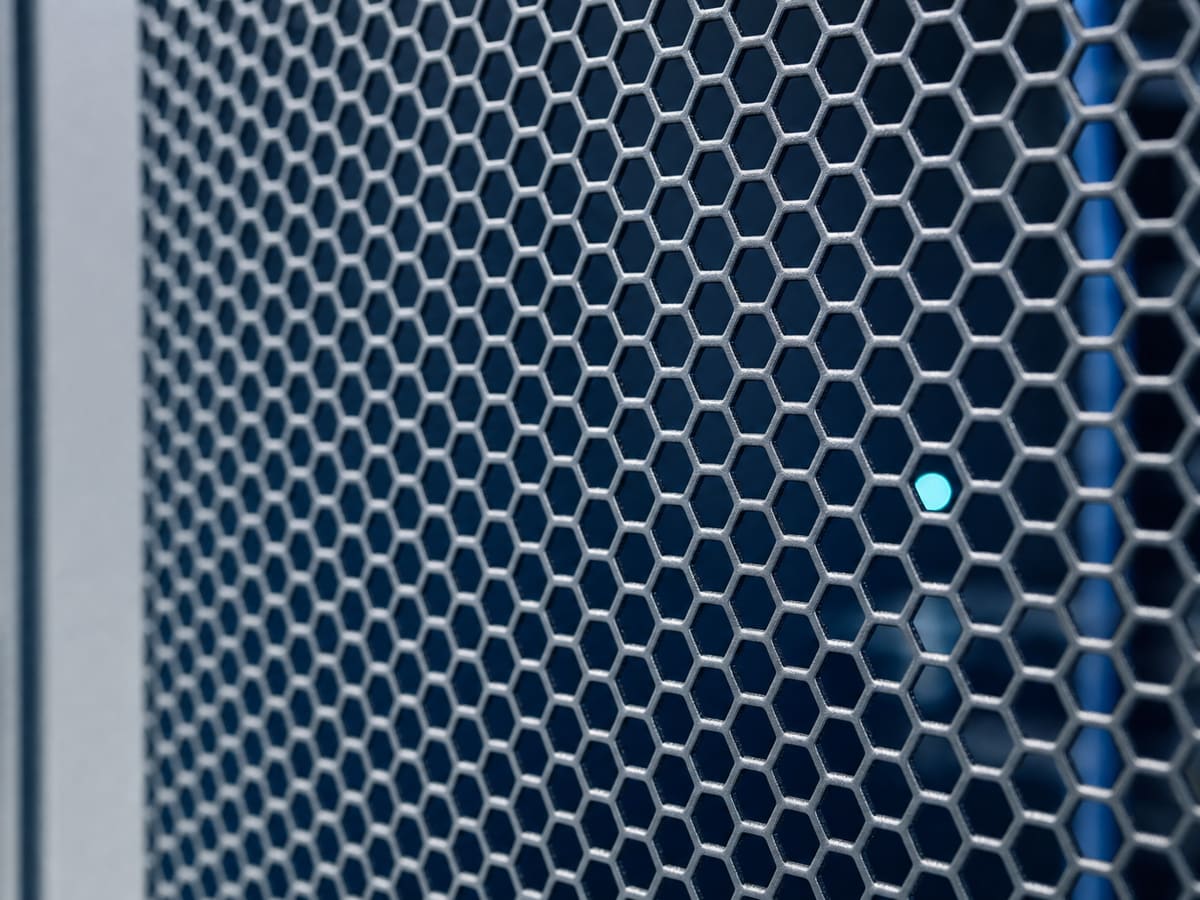 Server rack door perforation pattern in cool aisle light
